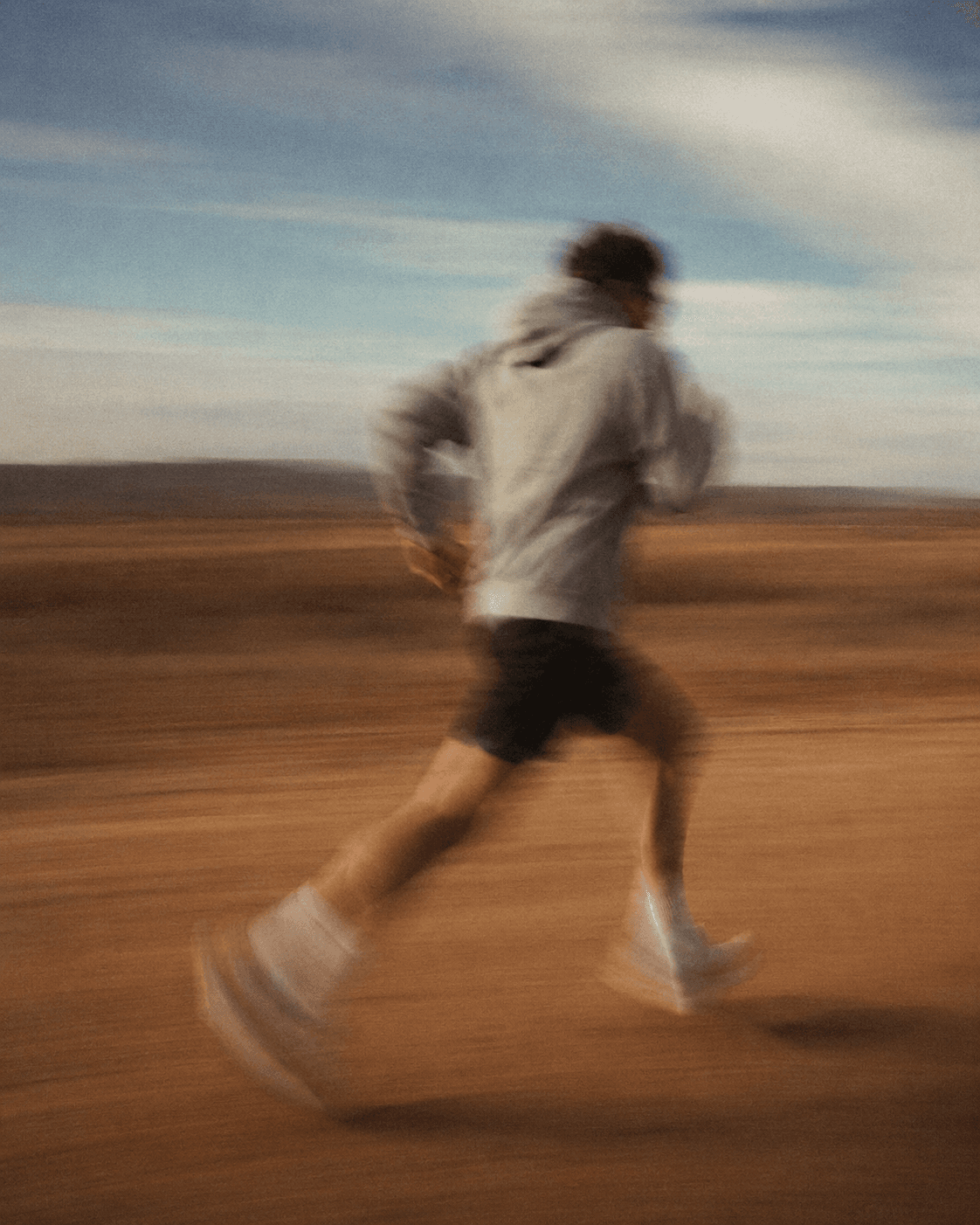 Blurred runner in a desert landscape for extreme race contexts